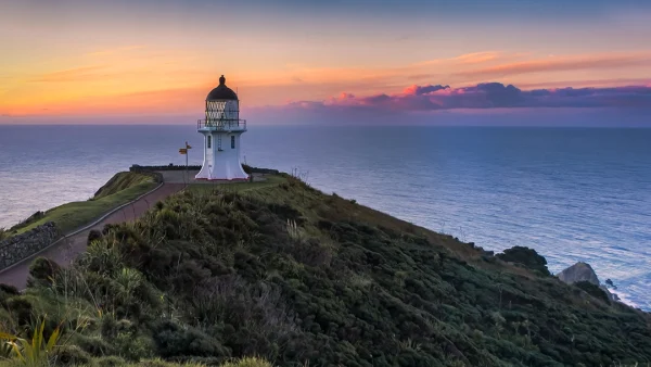 Cape Reinga – Sunset at Lighthouse on Rocky Peninsula with Meeting Seas