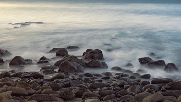 Rocks and the Sea – Long Exposure of Misty Waves Around Rocks at Whale Bay, Raglan